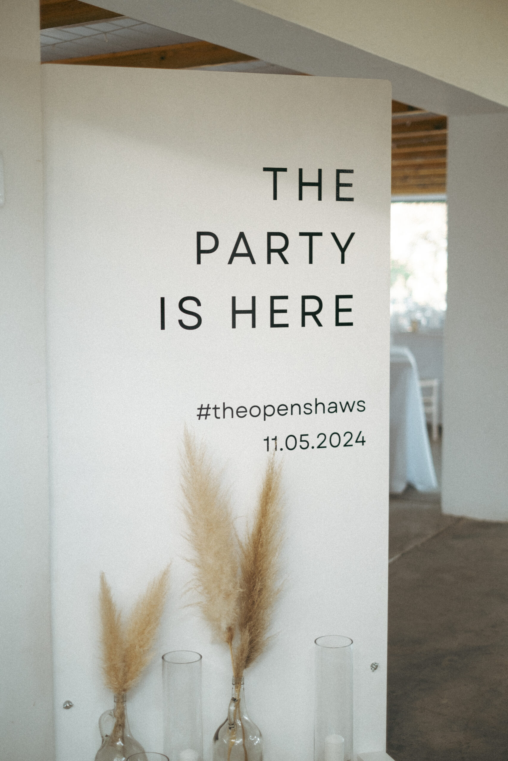 The party is here wedding sign